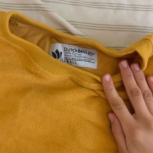 Dutch bros yellow thick sweater pull over, never worn great condition